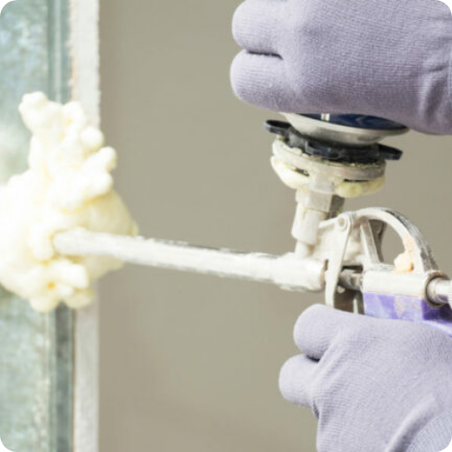 Spray foam insulating a roof panel