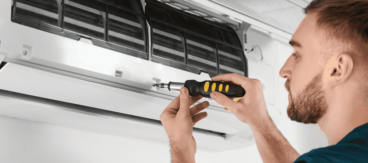 Man installing a mini split